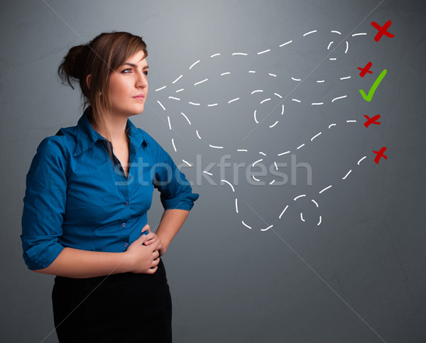 Stock photo: Young woman choosing between right and wrong signs