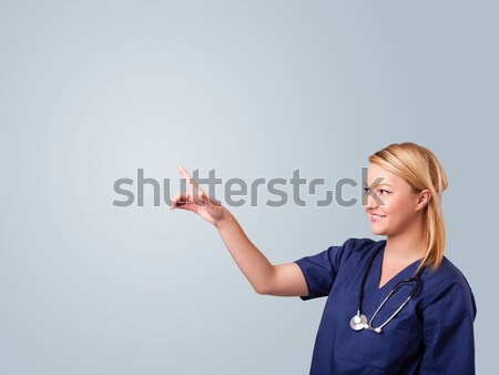 Jungen weiblichen Arzt gestikulieren Kopie Raum ziemlich Stock foto © ra2studio