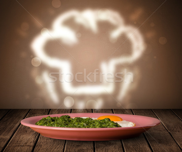 Delicious food plate with chef cook hat Stock photo © ra2studio