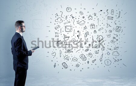 Worker with airbrush gun paints colorful lines and splashes Stock photo © ra2studio