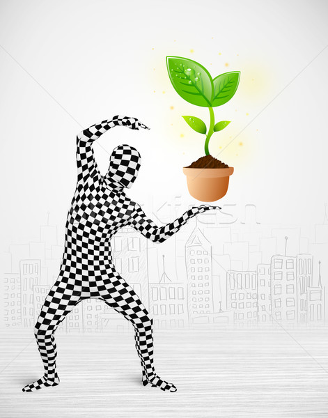 man in full body suit with eco plant Stock photo © ra2studio