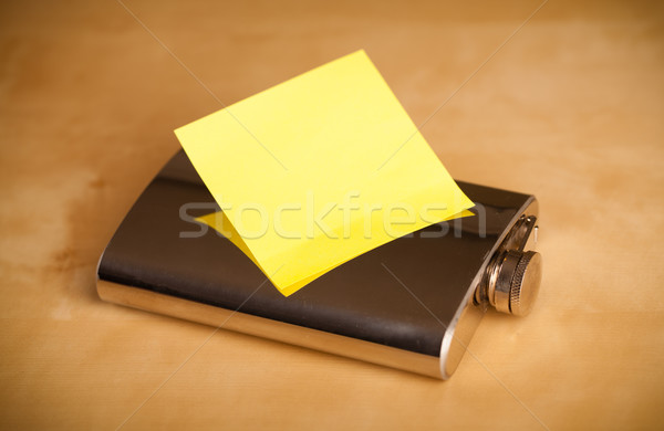 Empty post-it note sticked on hip flask Stock photo © ra2studio