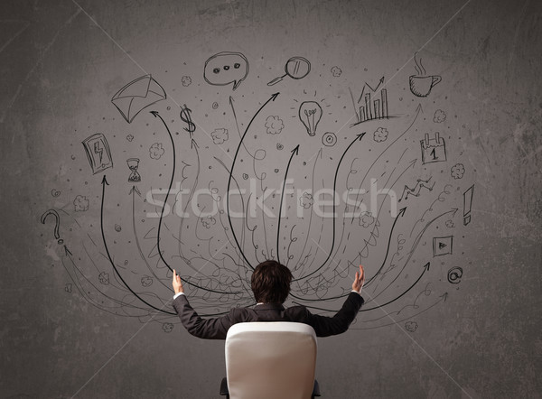 Businessman in front of a chalkboard deciding with arrows and si Stock photo © ra2studio