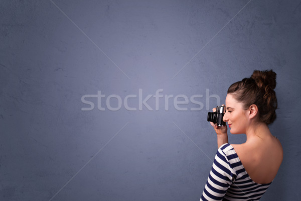 Photographer shooting images with copyspace area Stock photo © ra2studio