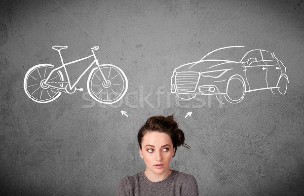 Woman making a choice between bicycle and car Stock photo © ra2studio