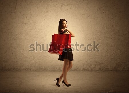 Shopping girl with bags and clear background Stock photo © ra2studio