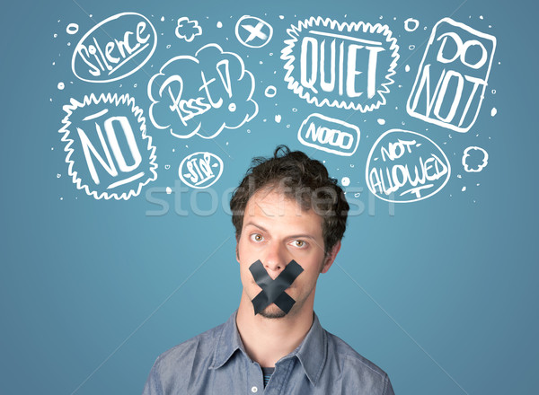 Young man with glued mouth and thought clouds Stock photo © ra2studio