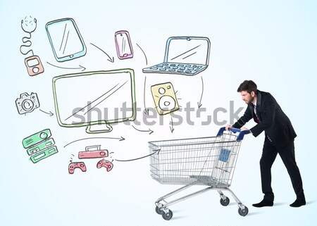 Businessman with shopping cart Stock photo © ra2studio