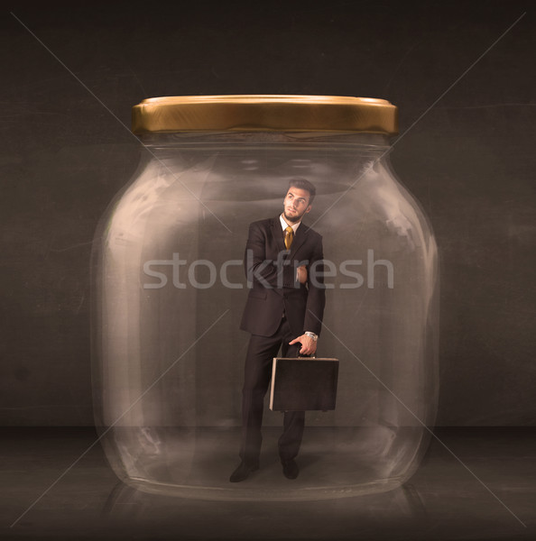 Businessman shut into a glass jar concept Stock photo © ra2studio