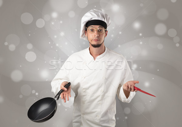 Male cook with shiny grey wallpaper Stock photo © ra2studio