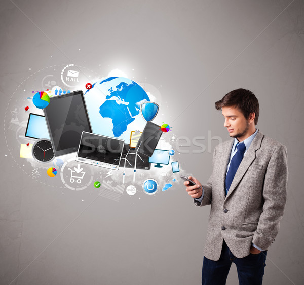 young boy standing and browsing on his phone Stock photo © ra2studio