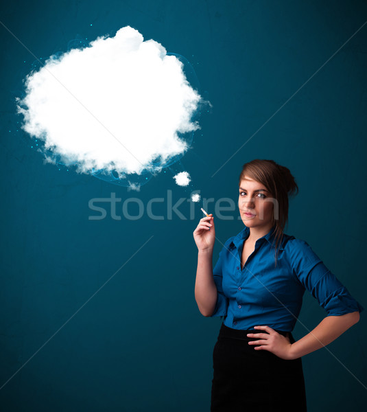Young woman smoking unhealthy cigarette with dense smoke Stock photo © ra2studio