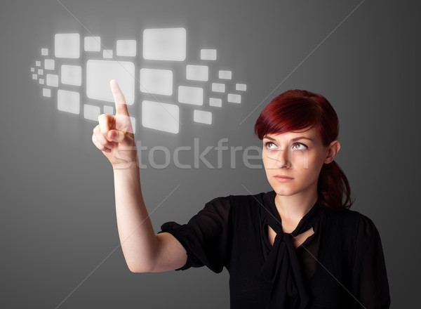 Businesswoman pressing high tech type of modern buttons Stock photo © ra2studio