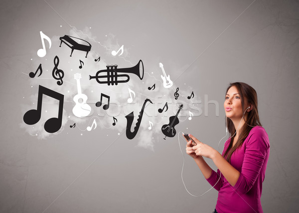 Beautiful young woman singing and listening to music with musical notes and instruments Stock photo © ra2studio