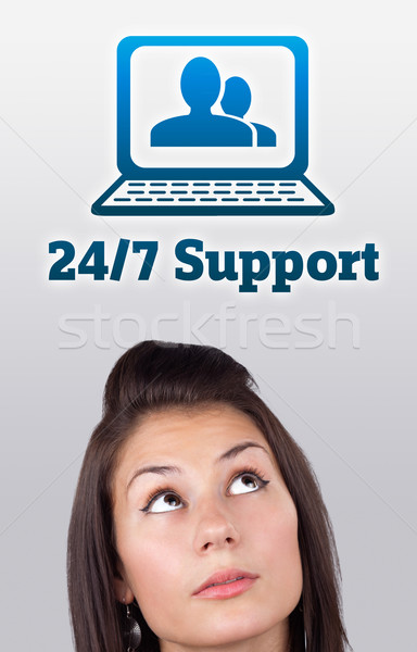 Young girl looking at support contact type of icons and signs Stock photo © ra2studio