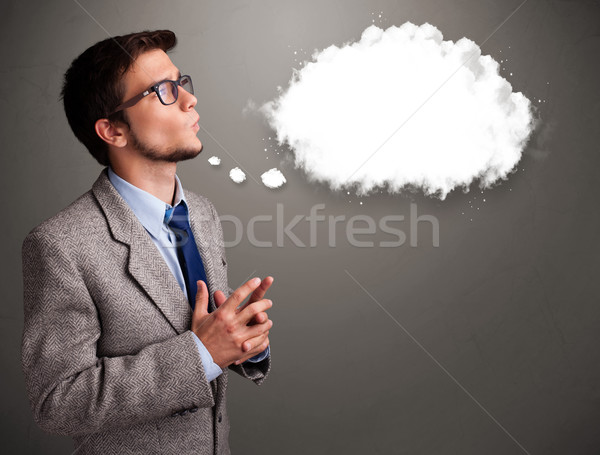 Good-looking young man thinking about cloud speech or thought bubble Stock photo © ra2studio