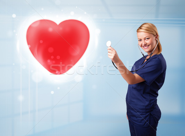 [[stock_photo]]: Jeunes · infirmière · guérison · rouge · coeur · joli