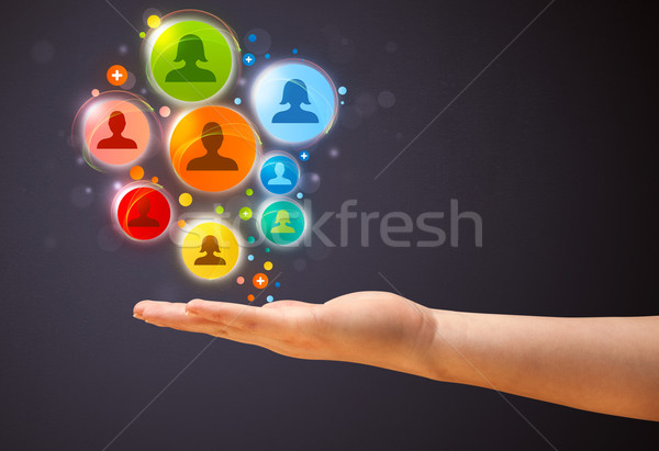 Social network icons in the hand of a woman Stock photo © ra2studio