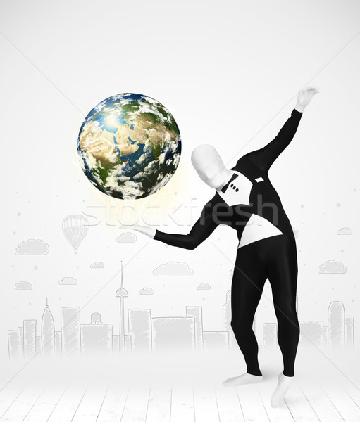 man in full body suit holding planet earth Stock photo © ra2studio