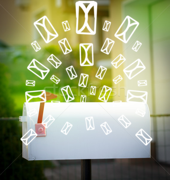 Mailbox with letter icons on glowing green background Stock photo © ra2studio