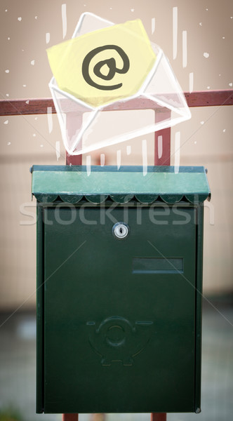 Envelope with email sign dropping into mailbox Stock photo © ra2studio