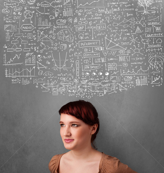 Stock photo: Young woman gesturing with sketched charts above her head