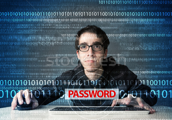 Stock photo: Young geek hacker stealing password 