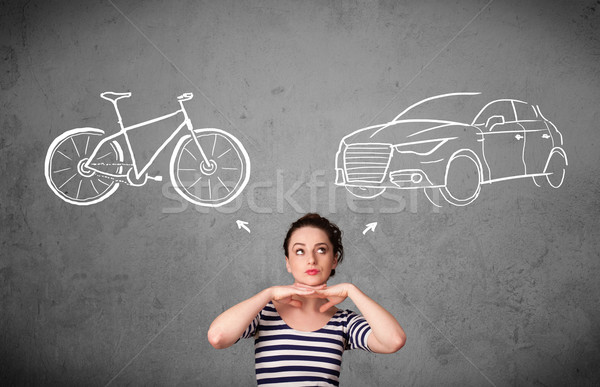 Woman making a choice between bicycle and car Stock photo © ra2studio