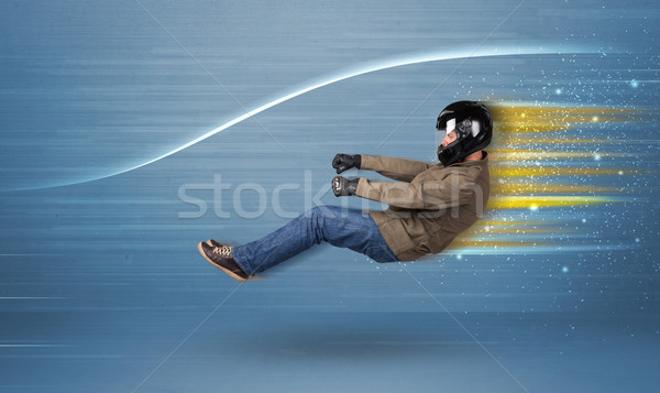 Young man driving in imaginary fast car with blurred lines  Stock photo © ra2studio