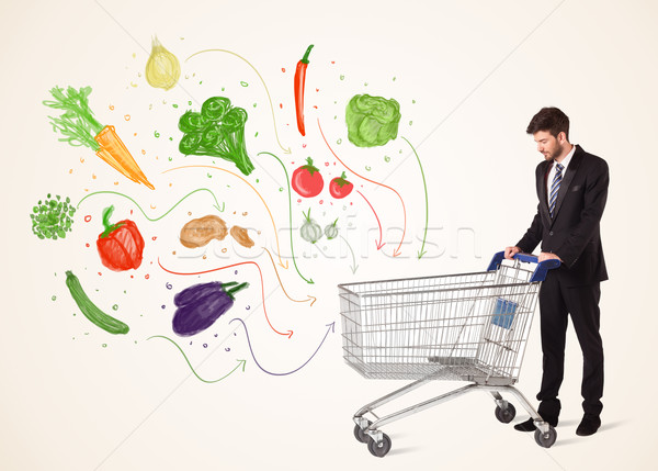 üzletember bevásárlókocsi zöldségek toló egészséges ki Stock fotó © ra2studio