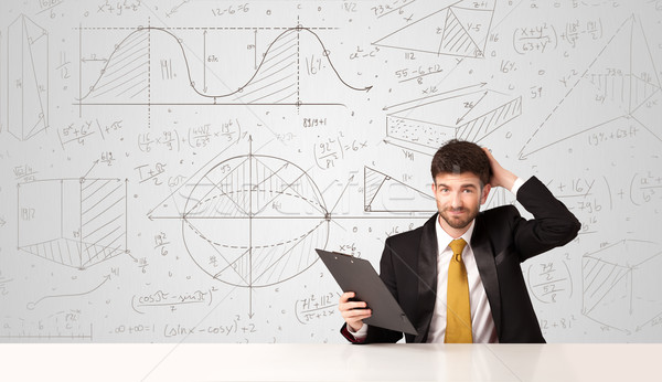 Businessman with business calculations background Stock photo © ra2studio