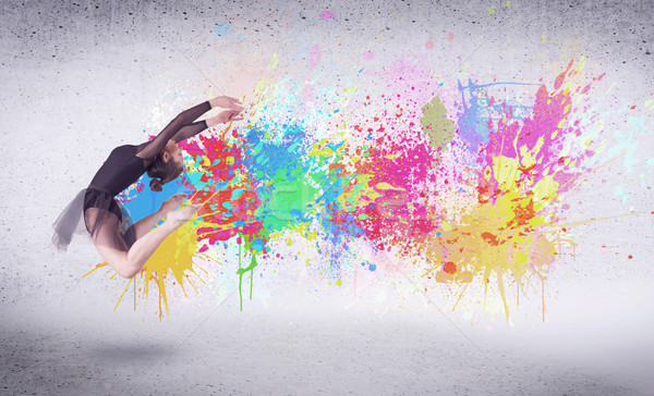 Modern street dancer jumping with colorful paint splashes Stock photo © ra2studio