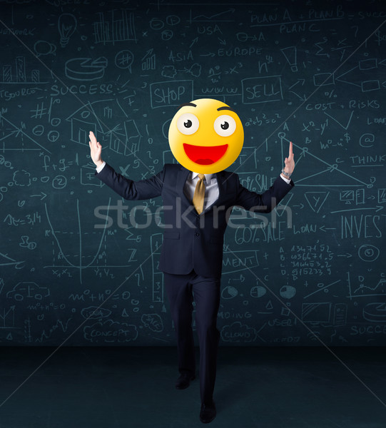 businessman wears yellow smiley face Stock photo © ra2studio