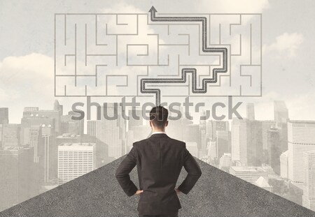 Businessman looking at road with maze and solution Stock photo © ra2studio