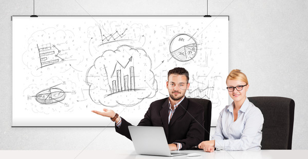 Business man and woman sitting at table with hand drawn graph ch Stock photo © ra2studio