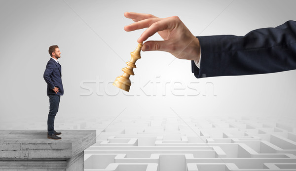 Little businessman from the top of the labyrinth thinking about strategies Stock photo © ra2studio