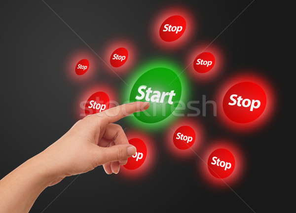 hand pressing Start button Stock photo © ra2studio