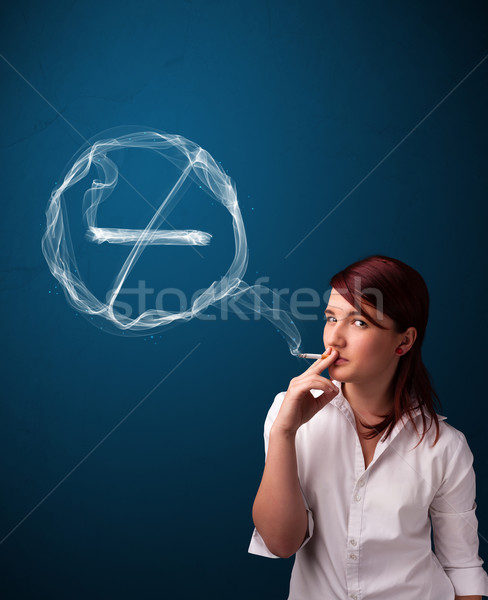 Young lady smoking unhealthy cigarette with no smoking sign Stock photo © ra2studio
