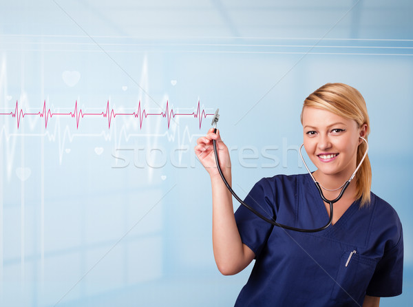 Stock photo: Pretty medical doktor listening to red pulse and heart rates