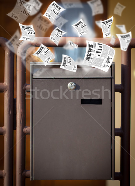 Stock photo: Post box with daily newspapers flying