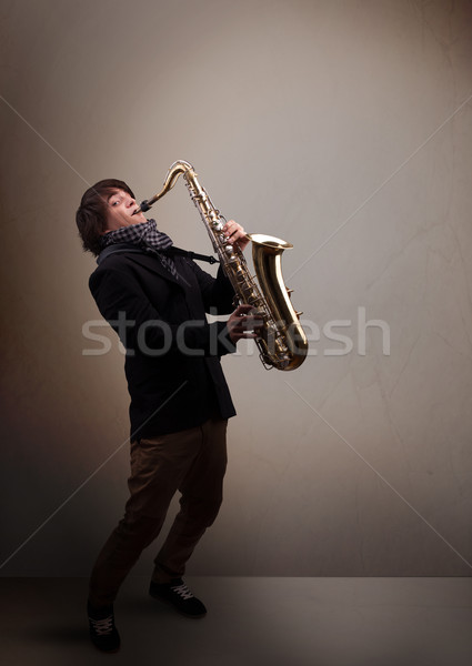 Jonge muzikant spelen saxofoon knap muziek Stockfoto © ra2studio