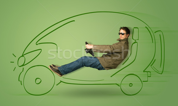 Man drives an eco friendy electric hand drawn car  Stock photo © ra2studio