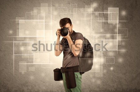 Male holdig professional camera with lens Stock photo © ra2studio