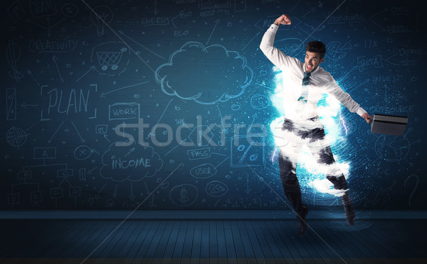 Happy business man jumping with storm cloud around him  Stock photo © ra2studio