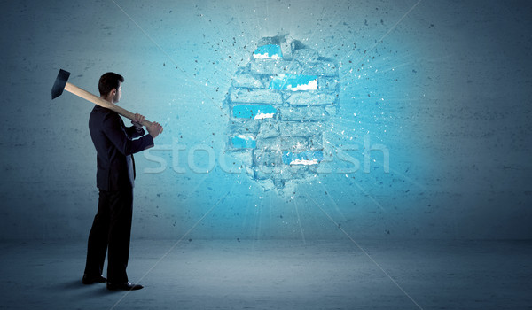 Business man hitting brick wall with huge hammer Stock photo © ra2studio