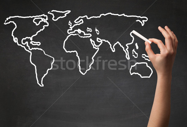 Adult drawing world map on chalkboard Stock photo © ra2studio