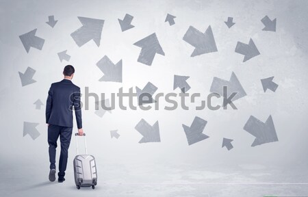 Businessman leaving with pell-mell arrows around Stock photo © ra2studio