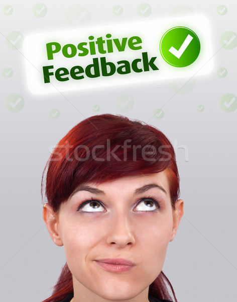 Young girl looking at positive negative signs Stock photo © ra2studio