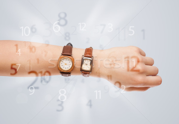 Hand with watch and numbers on the side comming out Stock photo © ra2studio