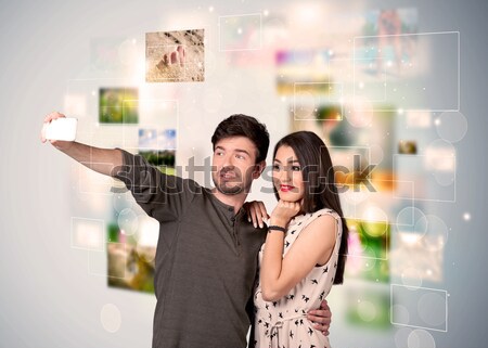 Stock photo: Happy young couple taking selfie pictures